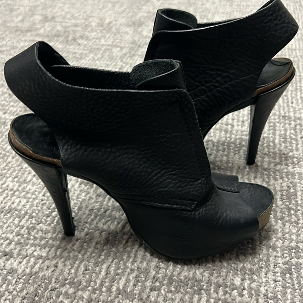 Super comfortable Pedro Garcia black peep toe heels.